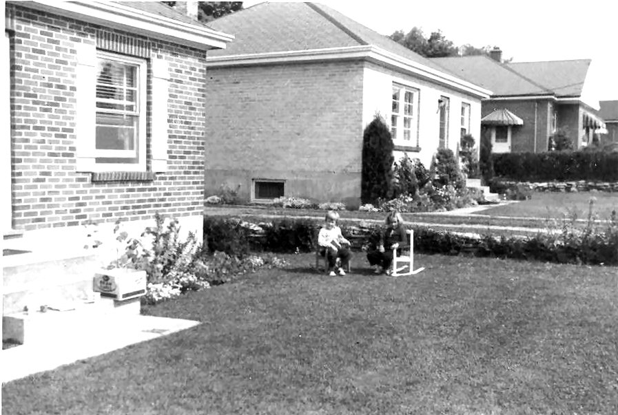 1958 about Lynne Strickland and Pam Anthonisen in front yard 268 Caddy.jpg