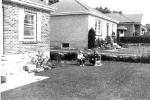 1958 about Lynne Strickland and Pam Anthonisen in front yard 268 Caddy.jpg