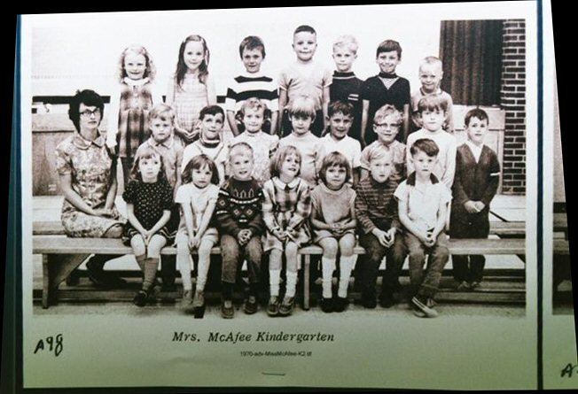 Paul Starr far right middle row with stripe on sweater